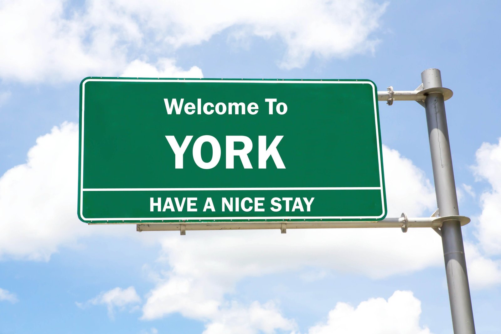 Green,Overhead,Road,Sign,With,A,Welcome,To,York,,Have City Of York Sign